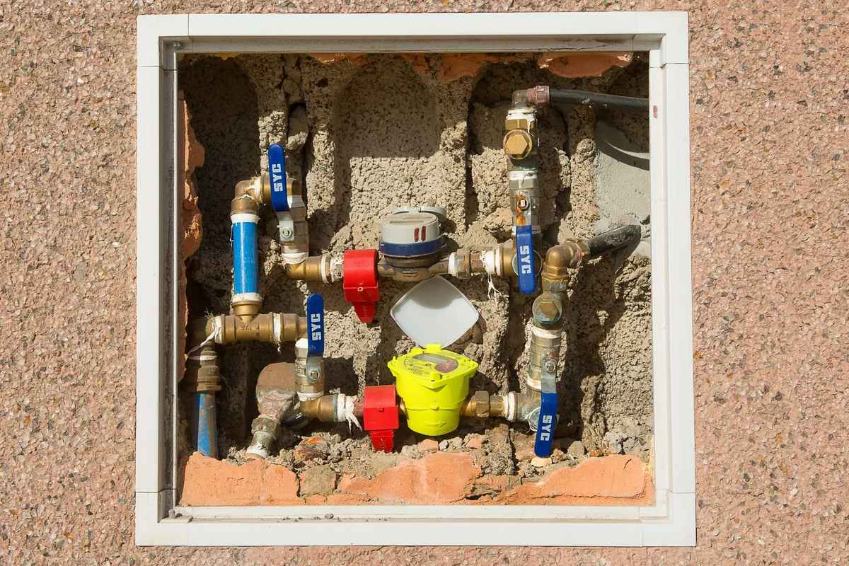 Water meter and stopcock inside a wall box