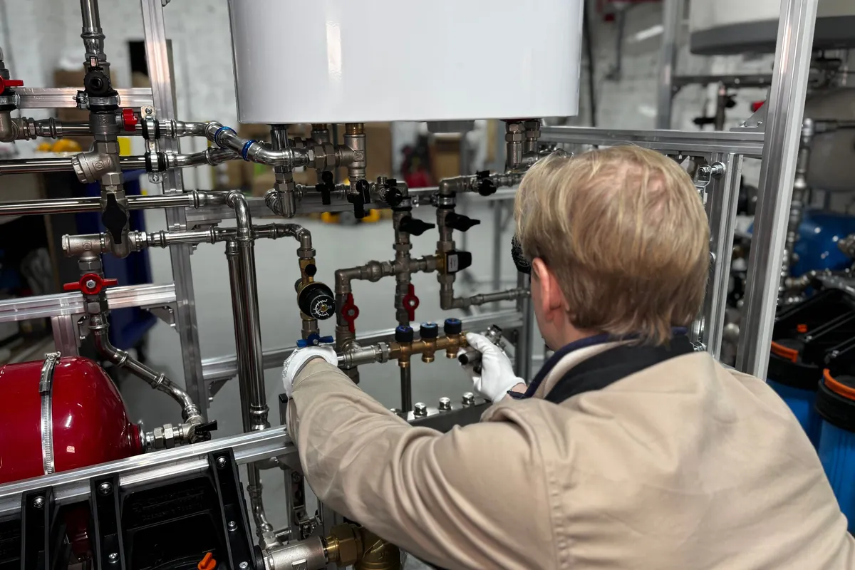 Engineer working on new boiler pipework
